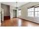 Open-concept living room with stairs, windows, and neutral color palette for easy customization at 700 Celeste Sw Ln, Atlanta, GA 30331