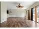 Bright living room with hardwood floors, a ceiling fan, and access to an outdoor deck at 700 Celeste Sw Ln, Atlanta, GA 30331