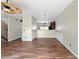 Hardwood floors span the spacious living room open to kitchen with stylish wainscoting at 700 Celeste Sw Ln, Atlanta, GA 30331