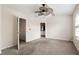 Spacious main bedroom with a ceiling fan and ensuite bathroom at 700 Celeste Sw Ln, Atlanta, GA 30331