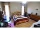 Cozy bedroom with hardwood floors and natural light, perfect for relaxation and rest at 985 Orchard Mill Ct, Lawrenceville, GA 30043