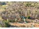 Scenic aerial shot of a lovely home surrounded by lush trees and natural beauty in a serene setting at 101 Hardwood Ln, Canton, GA 30115