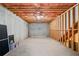 Unfinished basement with concrete floor, exposed ceiling and framing awaiting your personal touches at 101 Hardwood Ln, Canton, GA 30115