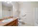 Well lit bathroom featuring a bathtub and sink with a granite countertop at 101 Hardwood Ln, Canton, GA 30115