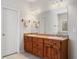 Bathroom vanity featuring double sinks, cabinet space, and decorative lighting at 101 Hardwood Ln, Canton, GA 30115