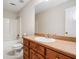 Bathroom featuring a single sink vanity with cabinets and a mirror, alongside a toilet and bathtub with shower at 101 Hardwood Ln, Canton, GA 30115