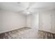 Bedroom featuring neutral walls and carpet, a ceiling fan, and doors leading to other rooms at 101 Hardwood Ln, Canton, GA 30115