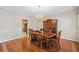Formal dining room with hardwood floors, decorative molding, and chandelier at 101 Hardwood Ln, Canton, GA 30115