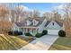 Charming, light blue two-story home with manicured landscaping and an attached two car garage at 101 Hardwood Ln, Canton, GA 30115