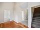 Spacious foyer featuring hardwood floors and staircase access, offering a grand entrance to the home at 101 Hardwood Ln, Canton, GA 30115