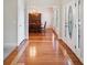 Inviting foyer with hardwood floors leading to an elegant dining room, enhancing the home's charm at 101 Hardwood Ln, Canton, GA 30115