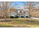 Inviting two-story home with a well-maintained lawn, mature trees, and a cozy front porch at 101 Hardwood Ln, Canton, GA 30115