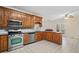 Updated kitchen with stainless steel appliances, granite countertops, and abundant cabinet space at 101 Hardwood Ln, Canton, GA 30115