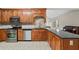 Functional kitchen featuring stainless steel appliances, granite countertops and wood cabinets at 101 Hardwood Ln, Canton, GA 30115