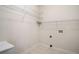 This laundry room features a utility sink and white wire shelving for storage at 101 Hardwood Ln, Canton, GA 30115