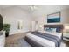 Staged main bedroom featuring high ceilings, neutral color palette, and ensuite bathroom at 101 Hardwood Ln, Canton, GA 30115