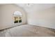 Spacious main bedroom featuring a large window letting in natural light at 101 Hardwood Ln, Canton, GA 30115