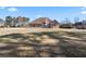 Expansive backyard featuring mature trees, a well-manicured lawn, and a single-story home at 2304 New Haven Pl, Conyers, GA 30094