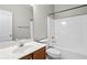 Clean and simple bathroom with tub-shower combination and single sink vanity at 2304 New Haven Pl, Conyers, GA 30094