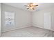 Neutral bedroom with natural light, carpet, ceiling fan, and plenty of space at 2304 New Haven Pl, Conyers, GA 30094