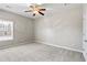 Neutral bedroom with natural light, carpet, ceiling fan, and plenty of space at 2304 New Haven Pl, Conyers, GA 30094