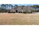Stately brick home with well-manicured landscaping, arched entry and large front yard at 2304 New Haven Pl, Conyers, GA 30094