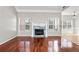 Living room featuring hardwood floors, fireplace with marble hearth, and natural light at 2304 New Haven Pl, Conyers, GA 30094