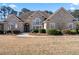 Charming brick home with landscaped yard, walkway, and beautiful entryway at 2304 New Haven Pl, Conyers, GA 30094