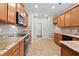 Well-lit kitchen features granite countertops, stainless steel appliances, and tile backsplash at 2304 New Haven Pl, Conyers, GA 30094