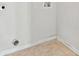Small laundry room with tile floors and washer/dryer hookups at 2304 New Haven Pl, Conyers, GA 30094