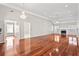 Spacious living room with hardwood floors, fireplace, crown moulding, and natural light at 2304 New Haven Pl, Conyers, GA 30094