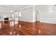 Open living room with hardwood floors, fireplace, crown moulding, and natural light at 2304 New Haven Pl, Conyers, GA 30094