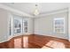 Sitting room featuring hardwood floors, large windows with plenty of natural light, and chandelier at 2304 New Haven Pl, Conyers, GA 30094