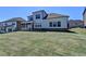 A well-maintained backyard featuring a lush lawn and a charming two-story home at 4217 Heisenberg Ln, Suwanee, GA 30024