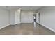 Bedroom featuring hardwood floors, recessed lighting, with two doorways and neutral color palette at 4217 Heisenberg Ln, Suwanee, GA 30024