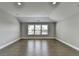 Bright bedroom featuring a large window and a neutral color palette at 4217 Heisenberg Ln, Suwanee, GA 30024