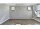 Light-filled bedroom with hardwood floors and neutral wall color at 4217 Heisenberg Ln, Suwanee, GA 30024