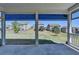 Covered patio with retractable shades overlooks a spacious backyard at 4217 Heisenberg Ln, Suwanee, GA 30024