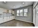 Dining area with built-in cabinets, granite countertops, and natural light at 4217 Heisenberg Ln, Suwanee, GA 30024