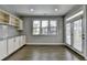 Breakfast nook area with built-in cabinets, granite countertops, and access to outdoor at 4217 Heisenberg Ln, Suwanee, GA 30024