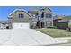 Attractive two-story brick home with a two-car garage and manicured lawn at 4217 Heisenberg Ln, Suwanee, GA 30024