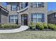 Inviting front entrance with brick facade, shutters, and a well-maintained yard at 4217 Heisenberg Ln, Suwanee, GA 30024