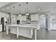 Modern kitchen with island, stainless steel appliances, and granite countertops at 4217 Heisenberg Ln, Suwanee, GA 30024