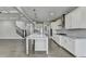 Gourmet kitchen open to the living space, with stainless appliances and granite countertops at 4217 Heisenberg Ln, Suwanee, GA 30024