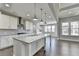 Open concept kitchen featuring an island with granite countertop, stainless appliances, and recessed lighting at 4217 Heisenberg Ln, Suwanee, GA 30024