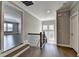 Upstairs landing with hardwood floors, iron railing and views of bonus room at 4217 Heisenberg Ln, Suwanee, GA 30024