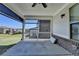 A covered patio with concrete flooring, a ceiling fan and views of the backyard at 4217 Heisenberg Ln, Suwanee, GA 30024