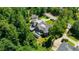 Aerial view of a stately home with a private pool and lush landscaping, nestled among mature trees at 4520 Garmon Nw Rd, Atlanta, GA 30327
