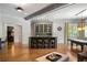 Entertainment area featuring a stylish bar with seating, custom cabinetry, and a pool table in the background at 4520 Garmon Nw Rd, Atlanta, GA 30327