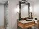 Bathroom boasts unique mirror, granite countertop, and walk-in shower at 4520 Garmon Nw Rd, Atlanta, GA 30327